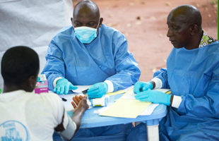 Ebola vaccine trial team follows-up with a trial participant, Katongourou, Guinea