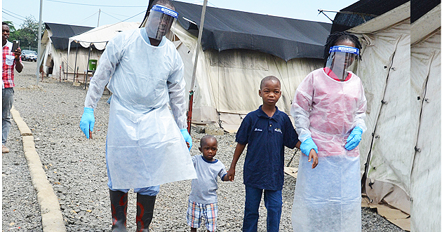 Two boys discharged from the Ebola treatment centre, 29 April 2016, Liberia